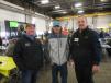 Dan Schwandt (R) of Nortrax, welcomes customers Zak Lagesse (L) and Alex Cicha, both of Chippewa Valley Excavating.