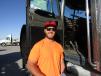 Cody Dellye, of Riverside, Calif., stops to take a closer look at this 1994 Peterbilt 379 truck for his growing company, Dellye Excavating.
