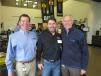 Doug Fabick (L), CEO and chairman of Fabick Cat, and Craig McArton (far R), executive vice president and COO, Fabick Cat, welcome Steve Rooney of Precision Pipeline to the two-day open house in Eau Claire, Wis.
