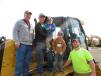 On the track of this Caterpillar D5K dozer are Patrick Franks (L), owner of Hawk Island Excavating & Landscaping; his son, Scott (second from L), and his sons, Beckham and Ryan Kinder; and his son, Benjamin.
