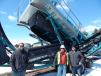 (L-R): Mike Gunderson of Theco Inc., Big Lake, Minn., with 49ers Assistant Training Director Dale Christenson and Ric Williams, also of Theco. Christenson said he was interested in adding a machine like this Powerscreen Chieftain 1400 to their training facility. 
