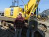 Doug Susany (L) of S.E.T. Inc. and Jeff Coomes of Coomes Excavating looked over this Komatsu PC290LC excavator at the auction.
