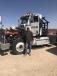 Jesse Martinez, Midland, Texas, stands with one of the eight 2010 Peterbilt 367 T/A day cab truck tractors that sold in the April 18 auction.
 