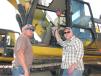 (L-R): K.R. Fulmer, Jeffery Brewer and Kenneth Peacock, all of M&C Enterprises in Petal, Miss., look over a Cat 336E excavator. 
