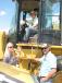 Evondia, Scooter and Jimmy Dean, all of Triple J Farms in Laurel, Miss., are interested in wheel loaders — specifically, this Cat 928G — for their farming operations. 