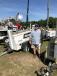 Uri Humphreys of Double H International Equipment, Wauchula, Fla., checks out light towers. 
