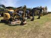 Auction-goers bid on a variety of John Deere, Cat and Komatsu mini-excavators. 

