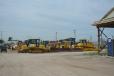A wide variety of dozers waits for a turn on the auction block.
 