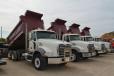 Mack trucks line up in search of new homes.
 