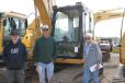 (L-R): Dale Sherman, Rodney Swartz and Al Symington of Karjal Trucking, Castleton, N.Y., check out the excavators. 