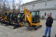 Alan Liguori of Chelmsford Landscaping Company, based in Lowell, Mass., looks over his JCB fleet.. 