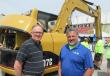 Mark Matson (L) of SCS Environmental catches up with MacAllister Cat’s Jason McCormick. 
