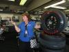 Lucille Dust of RPM tours answers questions about how many tires the teams go through on race day for customers touring the garage area. 
