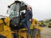 Brett Shultz of Summit Trading Co. checks out a Cat 930K wheel loader at the auction in Middleburg Heights.
 