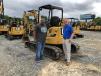 Robert Graham (L) of RFG in Charlotte, N.C., and Chris Mowbray of Carolina Cat discuss this Cat 305E2 mini-hydraulic excavator.