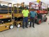 Allen Lane (L) and Emilio Silva, both of Silva Construction in Charlotte, N.C., take a closer look at some of the available equipment.