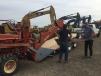 New owners of the Ditch Witch 4010 cable plow load up at the J. Stout Auction yard.  