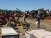 Potential buyers look through the more than 600 pieces of equipment in the yard before the auction on May 16.  