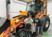 (L-R): Jacob, Mick and Dustin Hamilton, all of Hamilton Concrete, along with their kids Gavon, Jaxon and Lucus, admired the JCB GT at the event. 
 