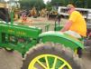 In between looking at heavy iron, Robert Wright (L) and Jeremy Petersen, both of Superior Grading in Liberty, S.C., check out an antique John Deere tractor 