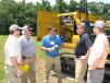 Rozier Blanchard (C) discusses the new excavators with (L-R): Cole McClam, Rusty McClam, Bob McClam and Jesse McClam, all of McClam & Associates Inc. in Little Mountain, S.C. 