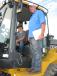 Raylan Vincent (L) and his father Johnny Vincent, both of Preferred Pine Straw in Branford, Fla., hope to find some machine bargains for their pine straw and farming operations — possibly this John Deere 544K loader. 
 