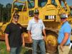 (L-R): Chad Seagraves of C&S Heavy Haul in Temple, Ga.; Chris Gore of Carl Owen Construction in Bremen, Ga.; and Toby Adams of Adams Equipment in Buchanan, Ga., look over some of the bigger Cat iron. 
 