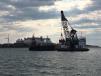 Work on a $123 million dredging project in New England’s largest seaport is under way, with plans to continue for about three years to deepen the project to its newly authorized depths.