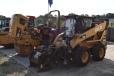 Potential bidders check out the pavers and skid steers up for bid. 