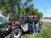 Standing with a Manitou MLT 625 (L-R) are Levi Kuyper, sales professional; Scott Weness, sales manager; and Chris Mullen, sales professional. 