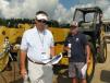 Interested in this Cat TH360B, are (L-R) Grant Dixon and Troy Mott, Providence Equipment, Dallas, Tex. 