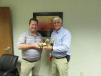 Massillon Branch Manager Mike Haney (L) thanks Congressman Bob Gibbs for his visit and presents him with a wooden model excavator.
 