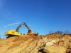 A Brubacher Excavating John Deere 450D excavator performs site work in 2017. 