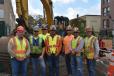 (L-R) are Craig Cypret, general manager of T-Quip; Kevin Swartz, T-Quip sales and rental rep of greater Boston; Corey Goldie, labor foreman, BOND; Shawn Hubbard, fleet manager, BOND; Rico Bisbano, equipment operator (in machine); Andrew Goldie, laborer, BOND; Johnny Williams, superintendent, BOND; and Paul Rutledge, laborer, BOND. 