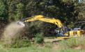 A LiuGong 925E excavator with an FAE forestry mulcher head cleared tree tops with ease. 