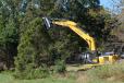 In a field test, a forestry contractor based in Franklin, Tenn., used one of his LiuGong 925E excavators, with an FAE mulching head attached, to perform a land-clearing job. 