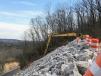 To help prevent future slides, crews are constructing a buttress using 130,000 tons of graded solid rock. 
(TDOT photo)
 