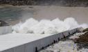 Water flows over the four energy dissipator blocks of the Lake Oroville main spillway, as the California Department of Water Resources releases water from the Oroville flood control gates down the newly-constructed main spillway.
(Kelly M. Grow/California Department of Water Resources photo) 