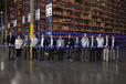 Doosan staff and dealers celebrate the new Doosan parts distribution center in Lacey, Wash., with a ribbon-cutting. 