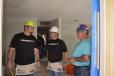 (L-R): Billy Igo, director of parts and service of Doggett, and Tim Holmes, general manager of Doggett’s Houston branch, discuss some interior work with Habitat for Humanity superintendent Patrick Ramb.
 
