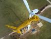 Crews use the LG 1750 crane to install the wind turbine’s blade socks.