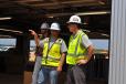 Hoar Construction senior superintendent Gary Merriman (L) discussing some of the project elements and construction efforts within the Talladega Garage Experience with Talladega Superspeedway’s incoming track President, Brian Crichton (R).