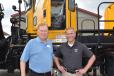  Jerry Tracey (L), president and founder of Tracey Road Equipment, discusses the new H series with Tim Donahue, regional sales manager of Oshkosh Airport Products.
