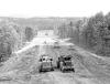 J. F. White equipment working on the Berkshire Bypass in Stockbridge and West Stockbridge, Mass., on Aug. 21, 1952. Left is a LaPlant-Choate TW-300 motor wagon and right is a Euclid bottom dump. White held the $2.2M project for a 2 mi. section of the road. The winning bid was low by a mere $61.50, beating NYC contractor, A.R. LaMura. The highway segment was incorporated into the Massachusetts Turnpike which was in the planning stage at the time. 
(Edgar A. Browning: J.F. White Collection photo)
