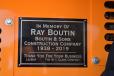 A plaque honoring the memory of Ray Boutin is mounted on the LeeBoy 8515E paver.
