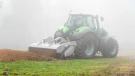 A PTO driven SFH 250 forestry tiller/mulcher kicks up some serious dust as it easily grinds stumps during the demo.
