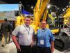 Brian Milne (L), Komatsu America Corp., and Mark Johnson, UEM, General Equipment & Supplies Inc., stand with the Komatsu PC130 excavator. 