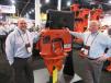 NPK President Dan Tyrell (L) and District Manager Ken Skala present the company’s NPK C-6CSD sheet pile driver from among the many NPK and Genesis attachments on display at the company’s booth. 