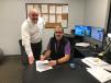 Dan Meara (L), regional sales manager of Terex Trucks, and Brett Arrowood, managing partner of Border Equipment, signed the dealer agreement. 