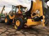 Although Volvo service checkpoints are among the easiest to access in the industry, you still need to climb a bit on these bigger machines.  Here, a Hoffman technician services an L180 7-cu.-yd. loader. 
